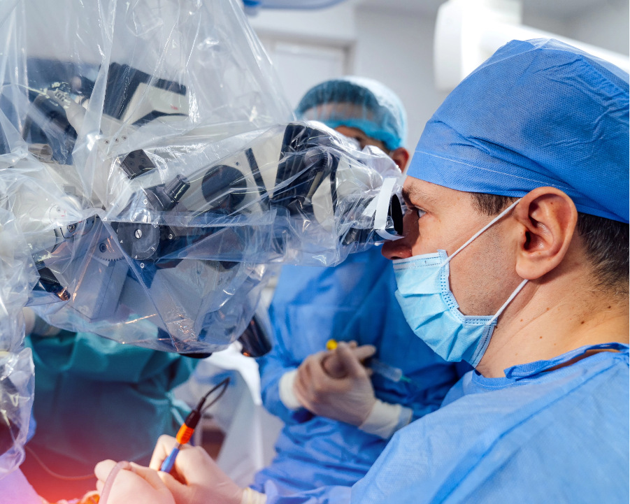 Surgeon operating a plastic-covered robotic device, representing New Age Medical's commitment to fast-tracking innovation and providing cutting-edge technology to hospitals.